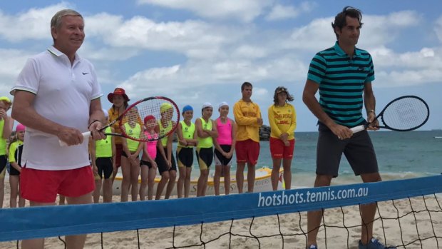 Premier Colin Barnett and Roger Federer teaming up for a game of beach tennis. 