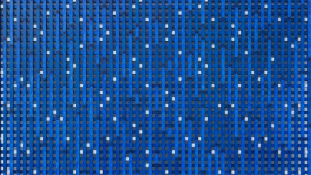 Hilarie Mais' <i>Reflection: Blue Angel</I> (2007-11) is a tightly-formed lattice of thin wooden slats punctuated by tiny squares of white that pick up and accentuate the different tones of blue.