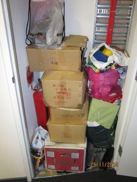 The fire extinguisher cupboard in a Docklands apartment was used to store tenants' belongings.