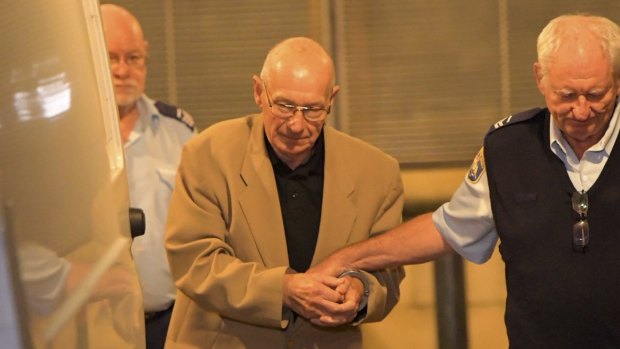 Roger Rogerson is led from the Supreme Court after giving evidence during the Jamie Gao murder trial on Friday.