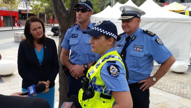 A police officer fitted with the new cameras, with Police Minister Liza Harvey looking on.