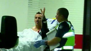 Ahmed Al Hamza pictured in 2016 being wheeled into the Royal Melbourne Hospital after being shot.
