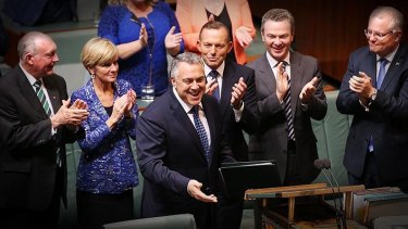 Treasurer Joe Hockey and Prime Minister Tony Abbott arrive to hand down the Budget in the House of Representatives at Parliament House on Tuesday 12 May 2015. 