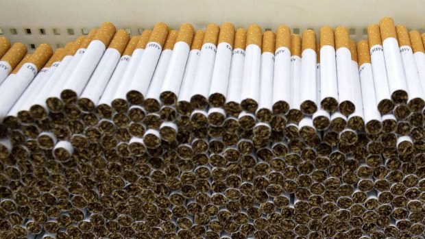 Stacks of cigarettes stand at a Philip Morris International production facility