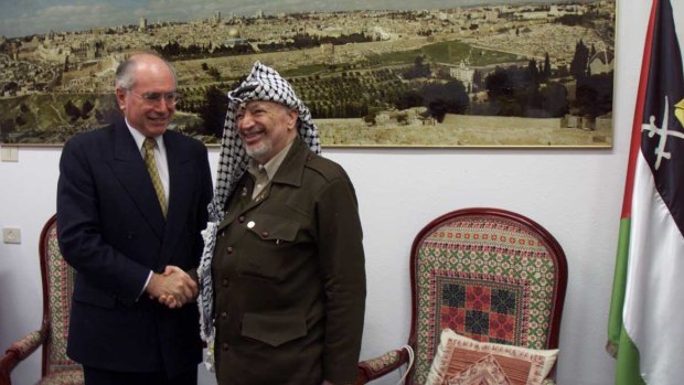 Then prime minister John Howard visits Yasser Arafat in Gaza.