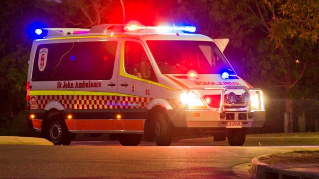 Paramedics stopped to move a woman off the road when they were hit with a pork chop in Darwin.