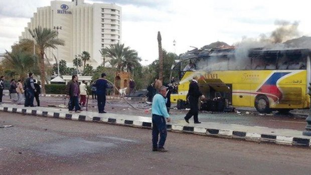 Smoke rises from a tourist bus in the Red Sea resort town of Taba on February 16. The government says an Islamic insurgency is on the rise.