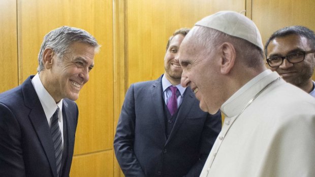 Pope Francis bestowed actor George Clooney with an award for promoting one of the Catholic Church's charitable foundations.
