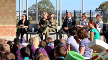 Barry Urban on Anzac Day wearing the fake medal at a school assembly.