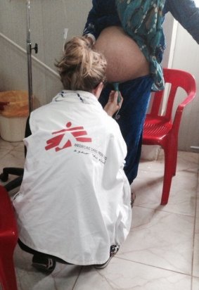 Elisha Swift examines a pregnant woman at the maternity unit in Domiz refugee camp.