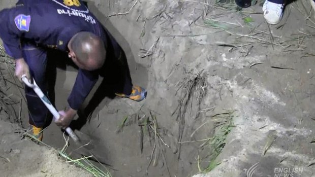 Wayne Schneider's body was found in a two-metre-deep grave in roadside bushes near a Chinese temple.