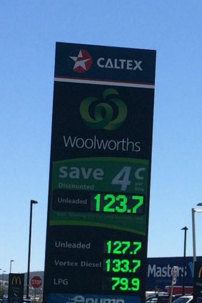 The electronic advertising sign outside the service station on Monday morning showing unleaded petrol at 123.7 cents per litre for customers with a discount, the same price as the supermarket chain’s rival Costco.