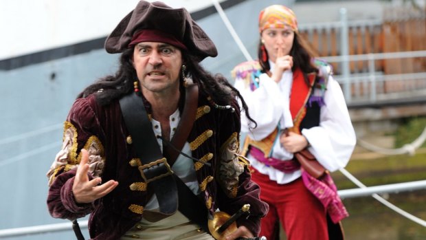 Ahoy: Captain Cutthroat (Doru Surcel) with the Gypsy Pirate (Christina Marks) in <i>Caribbean Pirates at the Polly Woodside</i>.