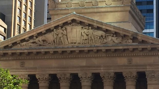 The Daphne Mayo "typanum" above the entrance to Brisbane City Hall, which indigenous man Sam Watson says shows indigenous people being gently 'pushed aside.'