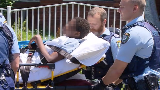 Police remove the boy from his Blacktown home.
