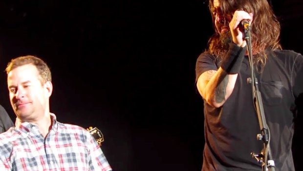 'Anthony the crying fan' is overcome and has to look away while on stage with Dave Grohl and the Foo Fighters in Colorado this week.