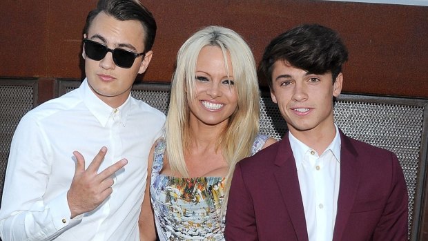 Pamela Anderson's 18-year-old son with drummer Tommy Lee, Dylan, is now working as a YSL model. Also pictured son Brandon, 19.