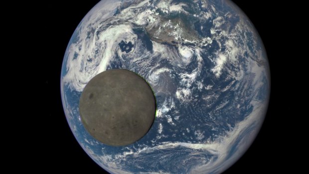 The moon passes in front of the Earth, as seen from NASA's deep space satellite, revealing the side we never see from the ground.