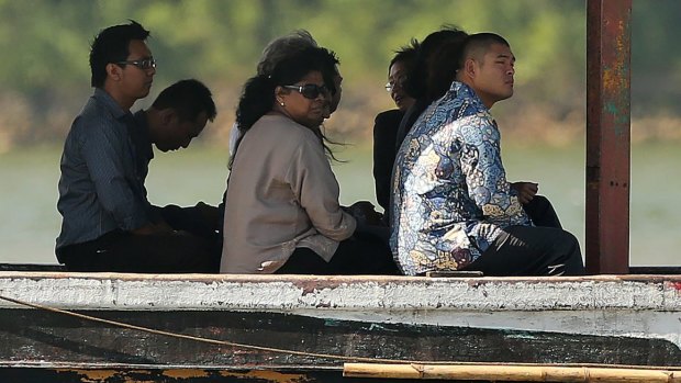 Raji Sukumaran, the mother of Myuran Sukumaran and Michael Chan, right, the brother of Andrew Chan among the families of both Bali Nine members on board a boat headed for to Nusakambangan for their first visit.