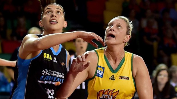 Canberra centre Marianna Tolo (left) will look to keep Suzy Batkovic at bay when the Capitals host Townsville on Saturday. 