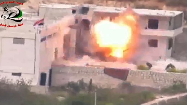 Footage supplied by the Free Syrian Army's Fursan al-Haq Brigade shows the moment of a US-supplied TOW missile's impact.
