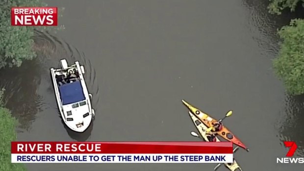 Kayackers and a boat operator came to the rescue of a man in the Yarra River.