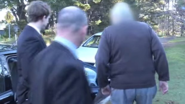 Paedophile priest Robert Flaherty being arrested at his Wentworth Falls home.