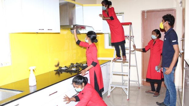 Indian maids being trained by GDH Workforce, an agency in Hyderabad, on how to clean kitchens and bathrooms and how to use a vacuum cleaner.