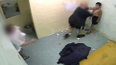 Officers restrain a youth detainee in the Northern Territory in 2010.