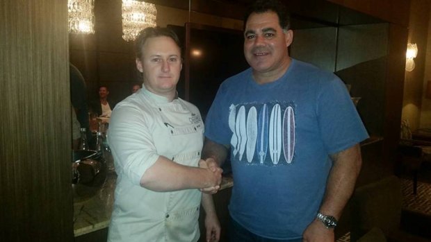 Mal Meninga is wished a happy birthday by Bacchus head chef Mark Penna before tonight's Origin series decider.