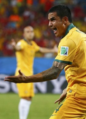 Tim Cahill protests against his disallowed goal.