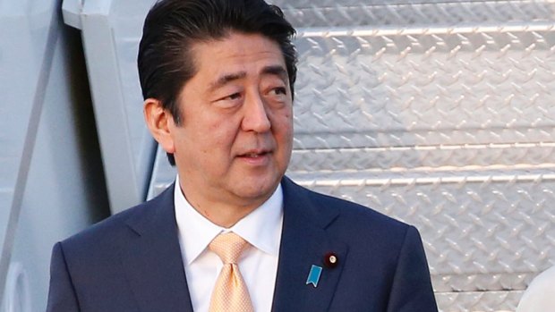 Prime Minister Shinzo Abe touts Japan's sliding rate of bankruptcies as an economic success.