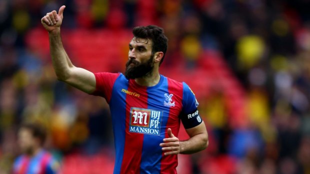 Crystal Palace skipper Mile Jedinak celebrates victory after the FA Cup semi-final against Watford.