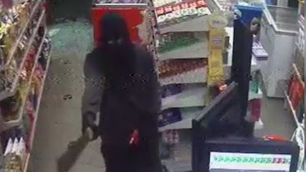 Police are hunting for a man who robbed a service station in Wynnum West on Sunday.