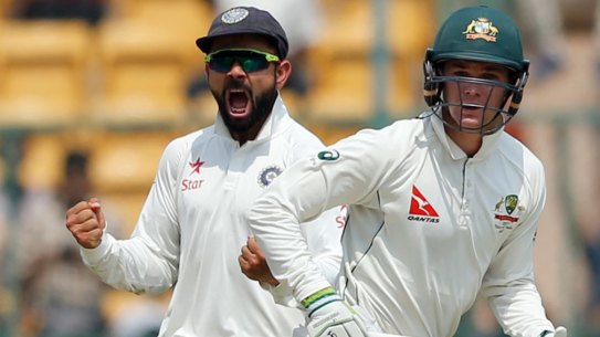 Virat Kohli (left) made up for his lack of runs with his talking game in the field.