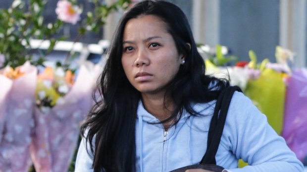 The wife of Andrew Chan, Febyanti Herewila, arrives at the family home.
