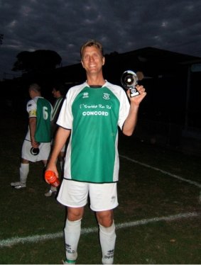 Proud trophy winner: Michael Cockerill during his park football days with Enfield Rovers.
