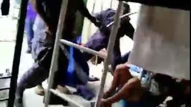 A video sent to Fairfax reporter Michael Koziol by a man in the Manus Island camp whom he knows only as Mohammed appears to show detainees being beaten during the November protest.
