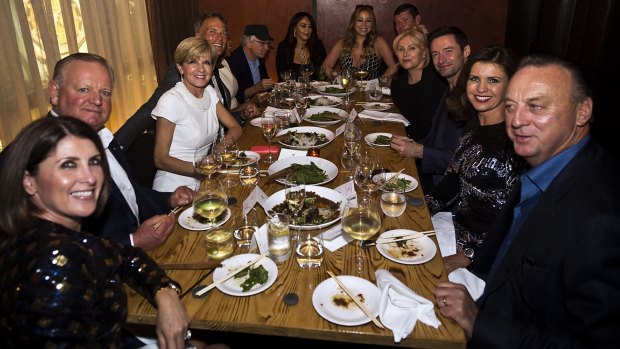 Foreign Minister Julie Bishop (third from left) hosts a charity dinner in New York attended by Robert De Niro,  Mariah Carey, James Packer, Deborra-Lee Furness and Hugh Jackman, among others. 