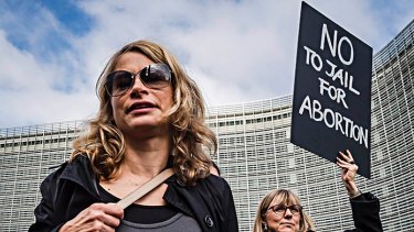 Polish women protest against a Polish legislative proposal for a total ban on abortion, near EU headquarters in Brussels, on Monday.