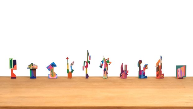 Robert Klippel's "No. 363", which features 93 constructions of coloured paper on a wooden table.