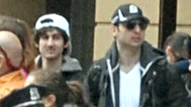 Nineteen-year-old Dzhokhar Tsarnaev, left,  with his brother Tamerlan at the Boston Marathon finish line on April 15, 2013. The FBI has struggled to identify triggers for radicalisation.
