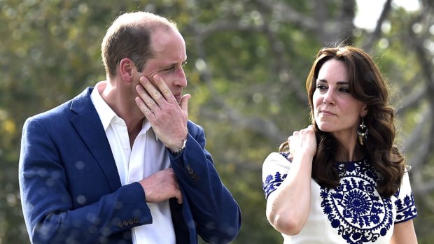 Prince William was spotted wiping his eyes after taking photographs with wife Catherine sitting on the same marble bench as Diana 24 years before.