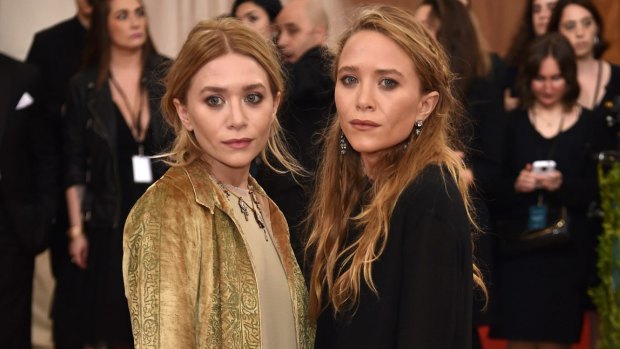 Ashley Olsen (left) and Mary-Kate Olsen, at last year's Costume Institute Gala, have become two of America's most sought-after designers.