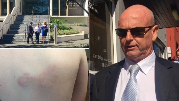 The boy and his parents, who cannot be identified by order of the court, depart Wollongong Courthouse on Monday morning before Andrew Slattery (right) makes his exit. Photographs showing welts to the boy's back formed part of the prosecution case.
