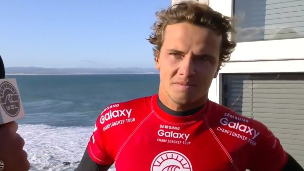 An emotional Julian Wilson speaks about how he tried to get to Mick Fanning as the shark lunged. 