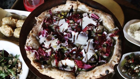 Figs, radicchio, dairy-free blue cheese, roasted pistachios and balsamic pizza at Gigi Pizzeria. 