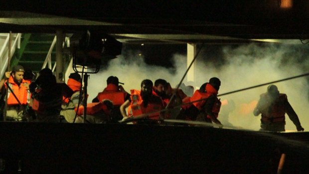 No investigation: Passengers on the Turkish ship the Mavi Marmara, surrounded by smoke from tear gas.