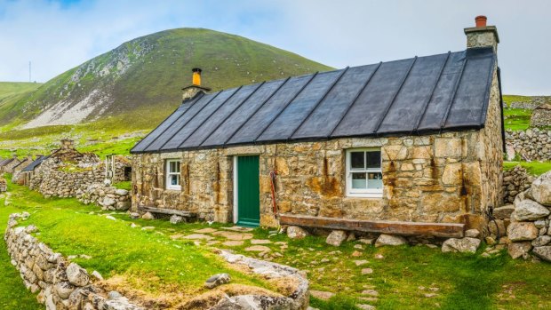 A renovated stone cottage among the village ruins on Hirta. 