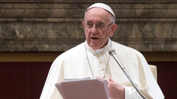 Pope Francis delivers his message to the Roman Curia at the Vatican.